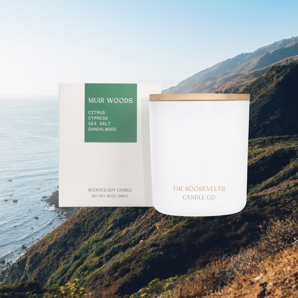 White candle jar with green Muir Woods label and wood lid, The Roosevelts Candle Co