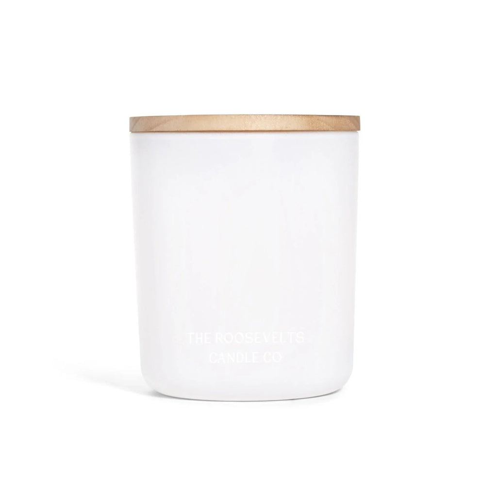 White candle jar with natural wood lid and embossed The Roosevelts Candle Co logo