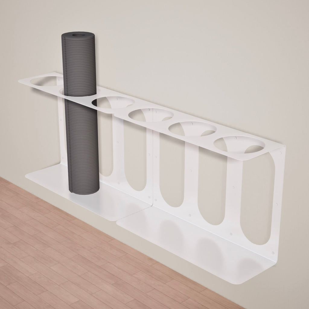 White yoga mat rack holding three rolled yoga mats, side angle
