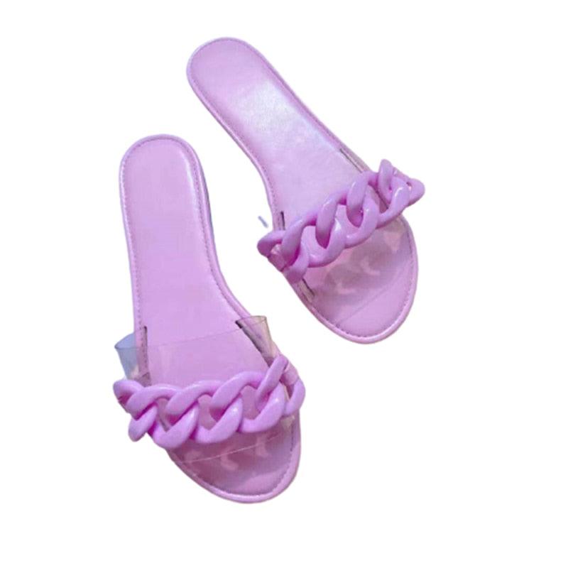 Purple open-toe flat slide sandals with braided chain strap detail
