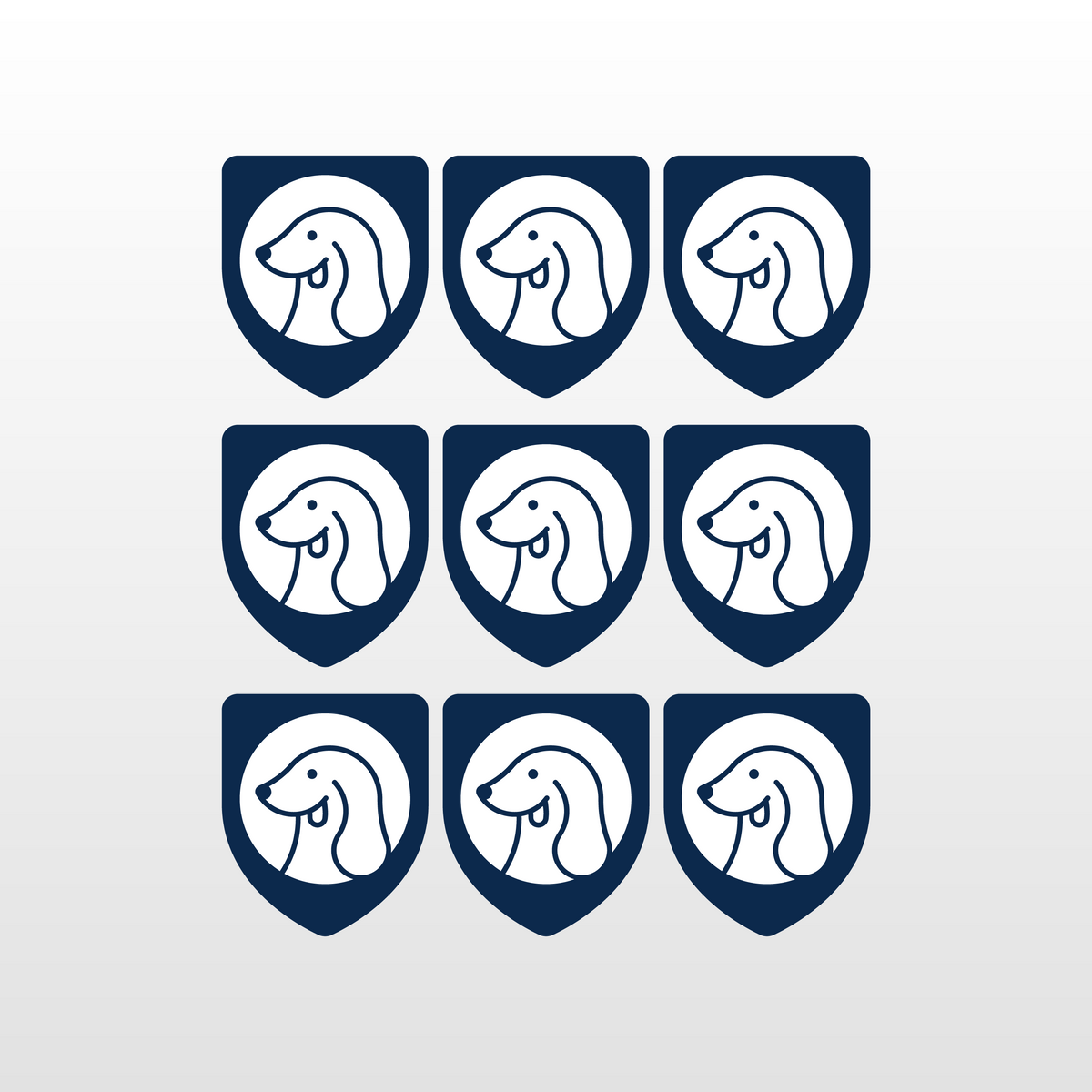 Nine dark-blue shield icons with smiling child face logo