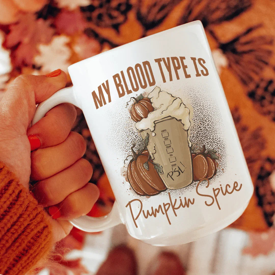 White 15oz ceramic mug: 'My Blood Type Is Pumpkin Spice' with pumpkin graphics