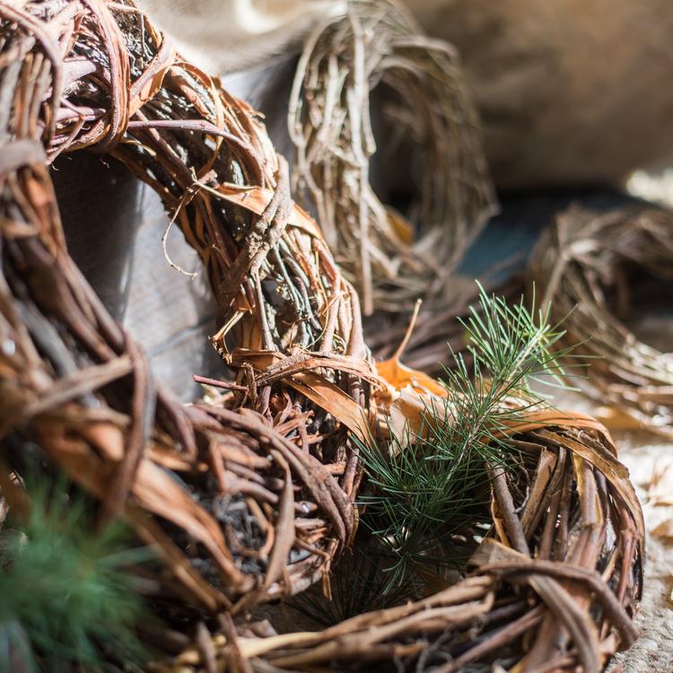 Natural twig wreath with pine needles and curved brown branch ring
