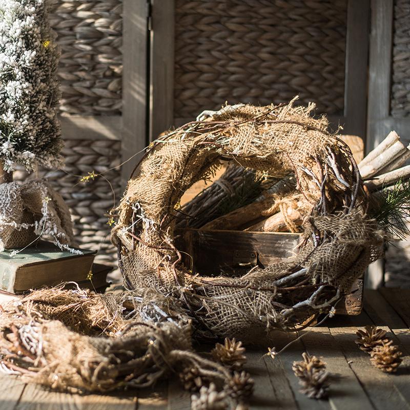 Natural burlap-wrapped rattan wreath ring with pine accents and glittery greenery