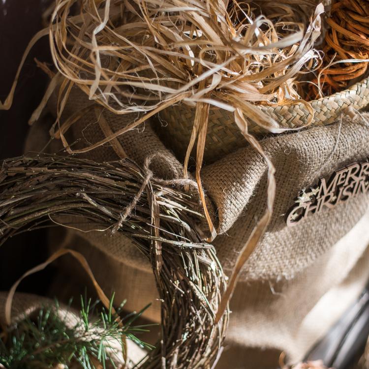 Rustic twig wreath with pine needles and burlap backing detail