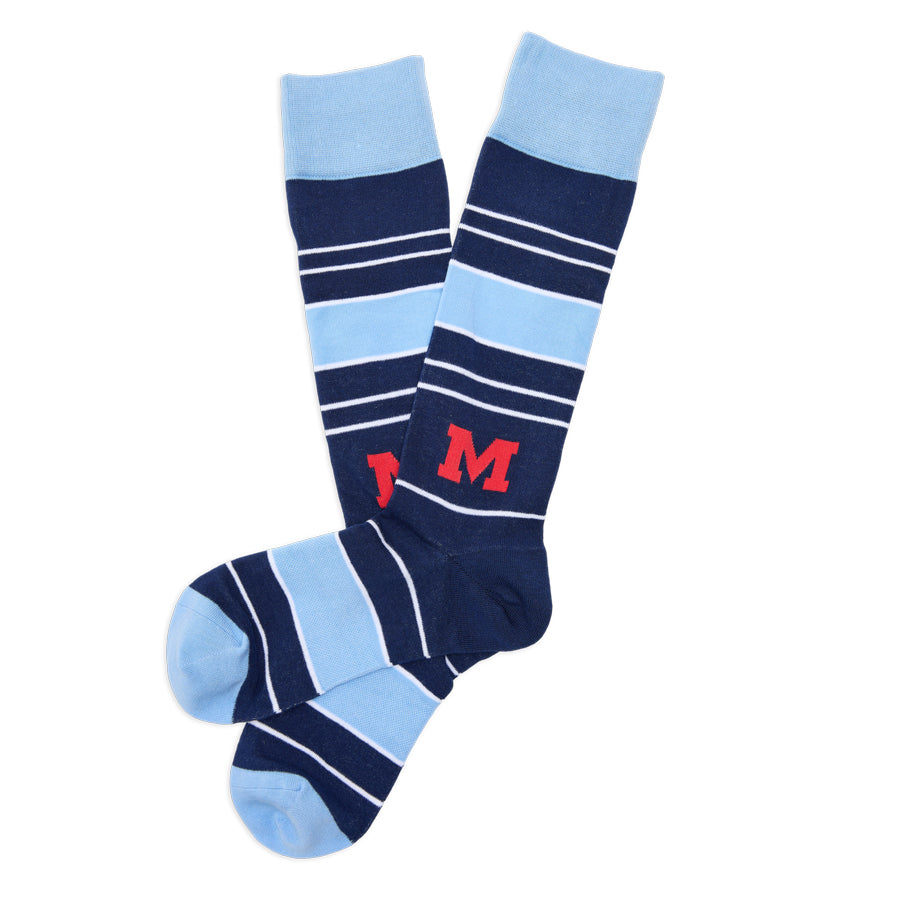 Pair of crew dress socks in navy and light blue stripes with red M logo