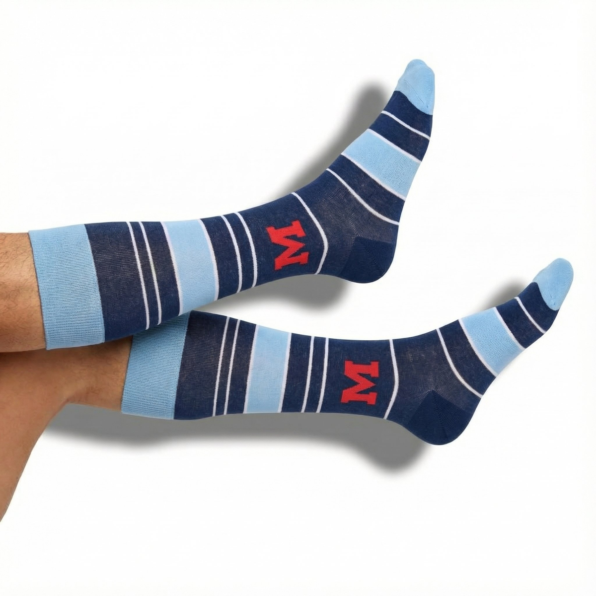 Navy and light blue striped dress socks with red M logo, crew length