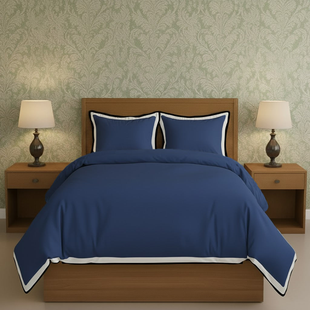 Navy blue duvet cover set with white border frame and matching pillow shams