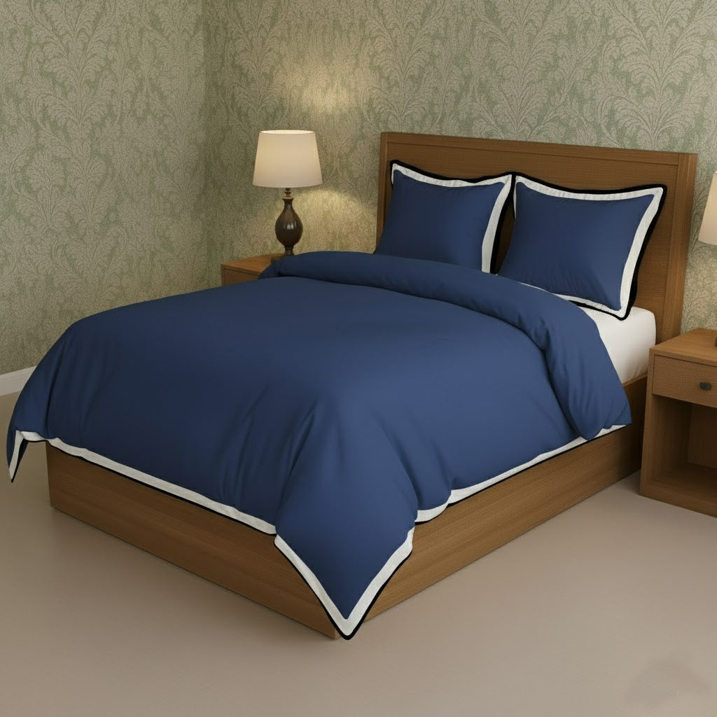 Navy blue duvet cover set with white border frame and matching pillowcases