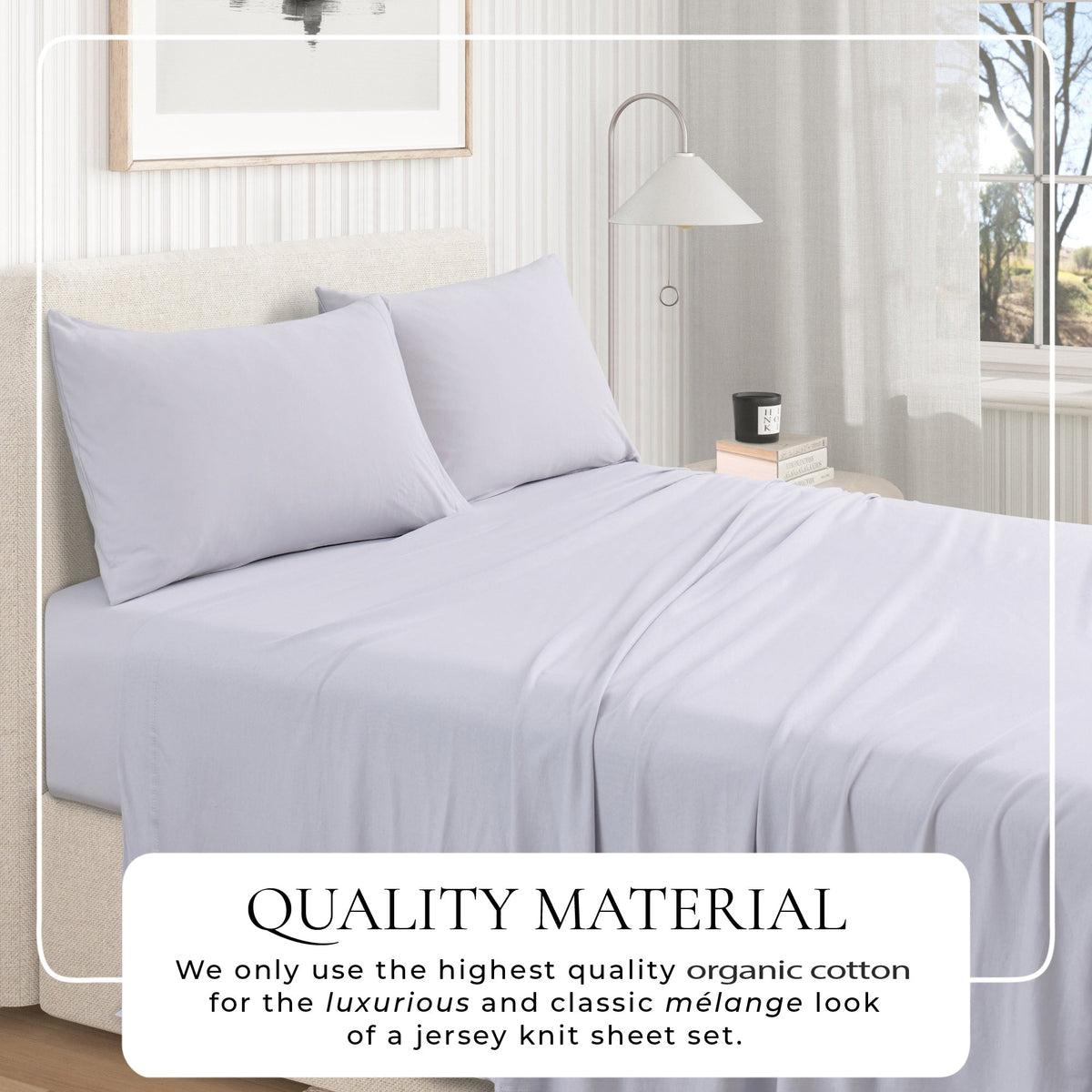 Jersey knit sheet set on bed with pillows, light grey