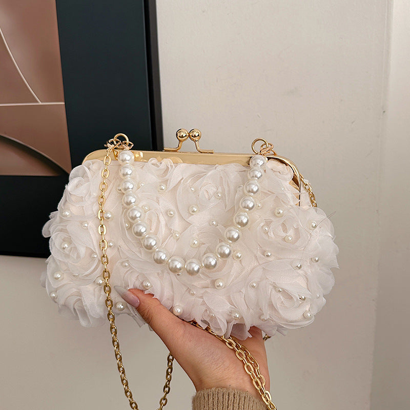 White lace pleated clutch handbag with faux pearl beaded frame and gold chain strap