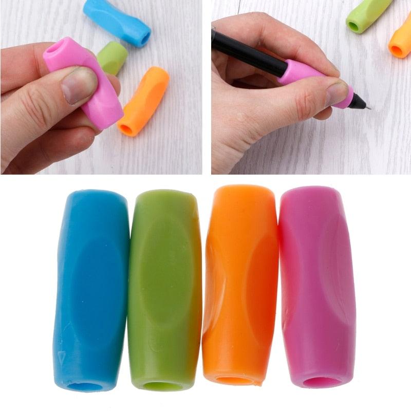 Slip-on pencil grips in pink, blue, green, and orange; hand grips black pen with pink