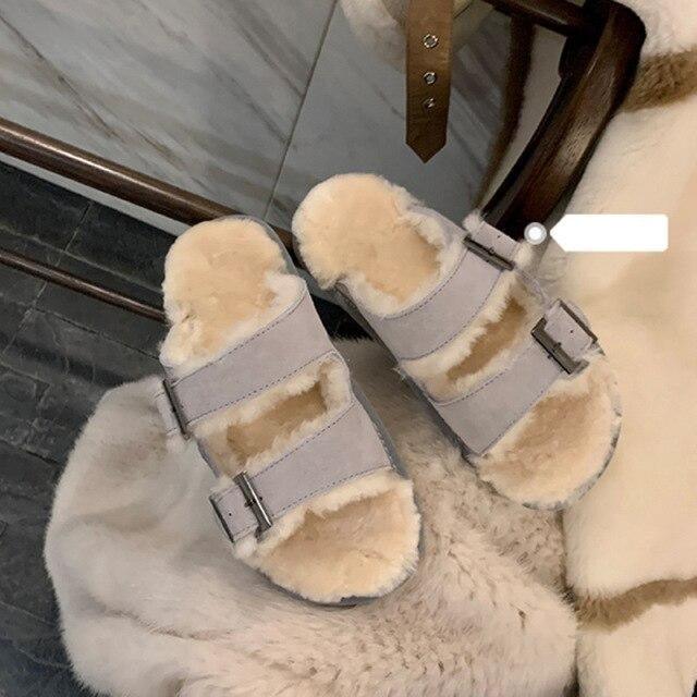 Light gray double-buckle faux-fur slippers with adjustable metal straps