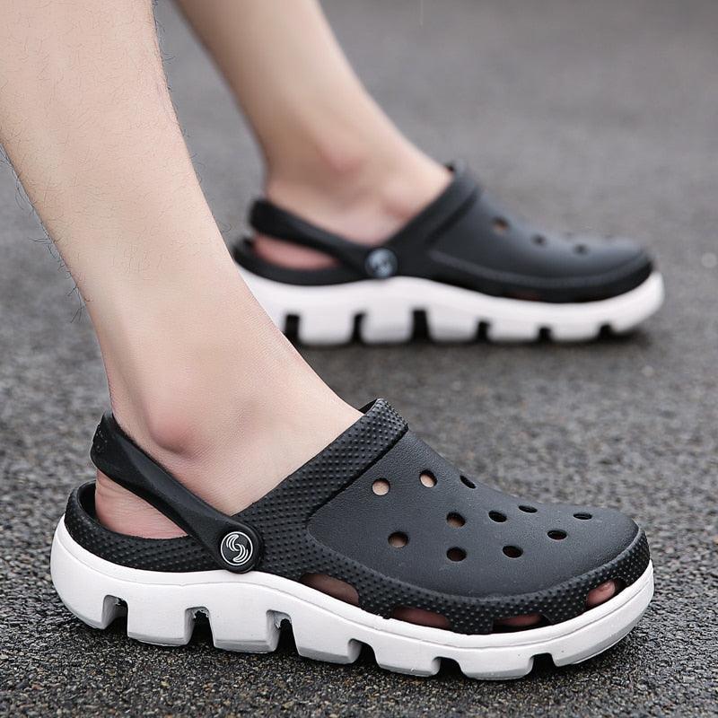Men's slip-on garden clog sandals, black with white outsole and adjustable heel strap