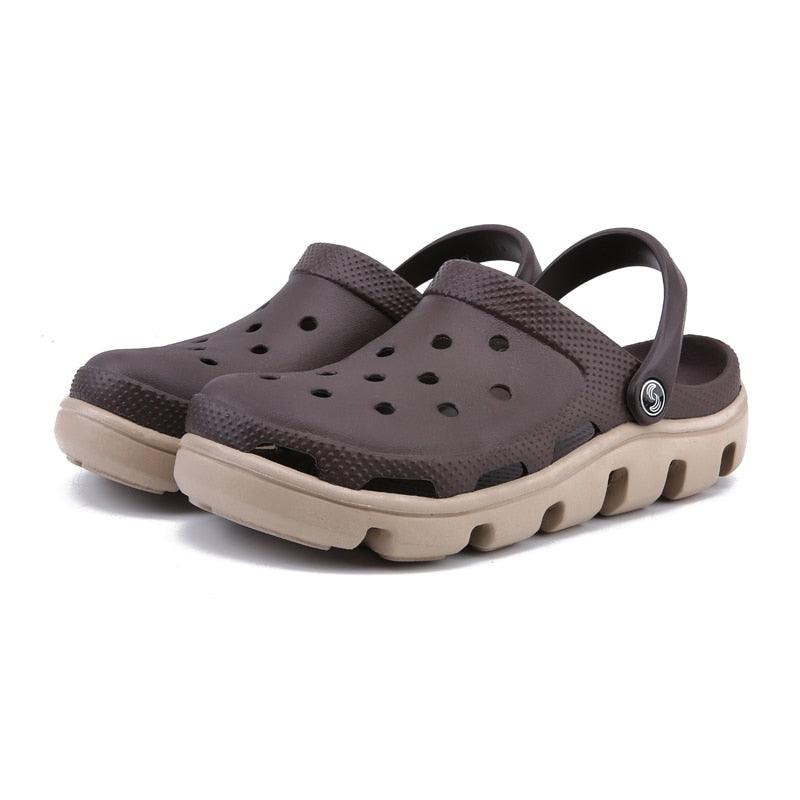 Gray men’s perforated clogs with adjustable strap and beige/black rugged sole