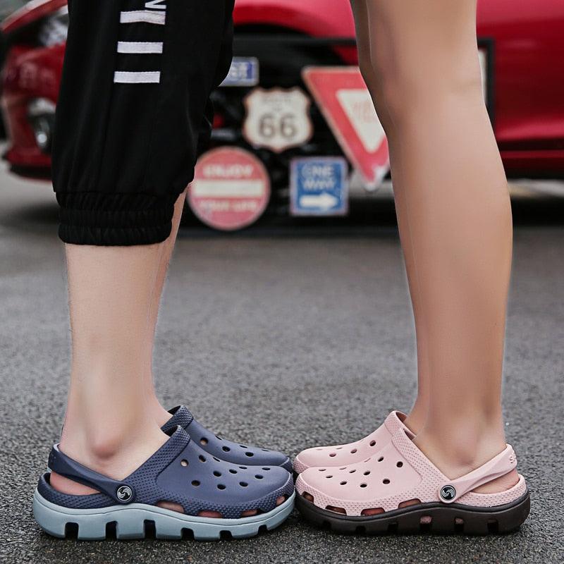 Men's blue and pink perforated jelly clogs with adjustable straps and thick tread