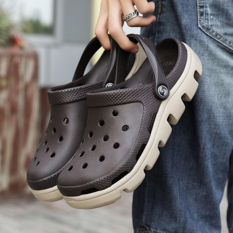 Men's dark brown perforated jelly clogs with adjustable strap and beige sole