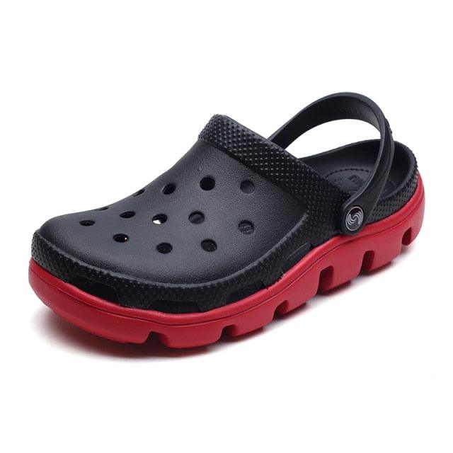 Black perforated clogs with adjustable back strap and red chunky sole