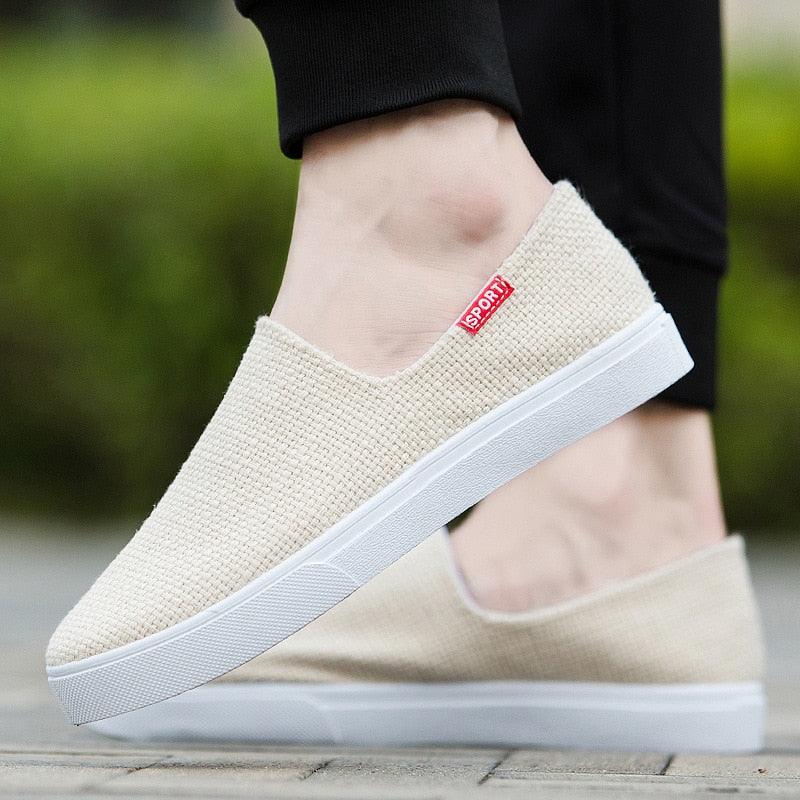 Beige canvas slip-on sneakers with white rubber sole