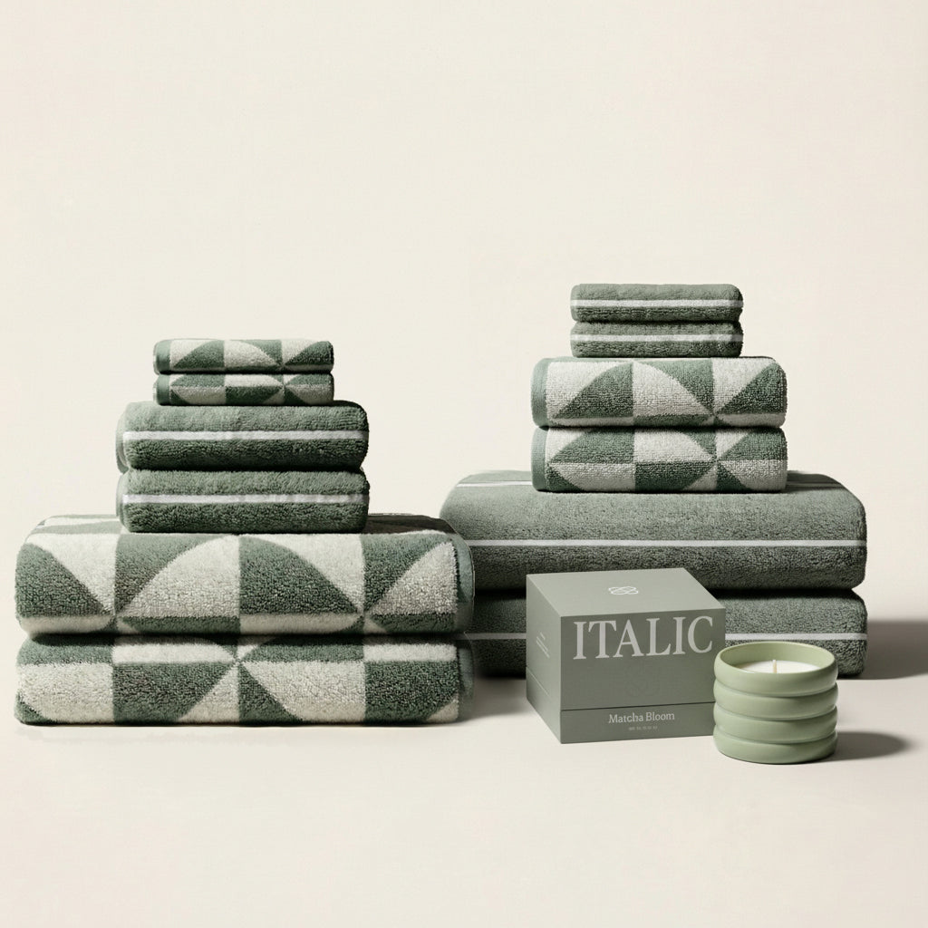 Deia cotton towel set with sage green stacks and green-patterned towel