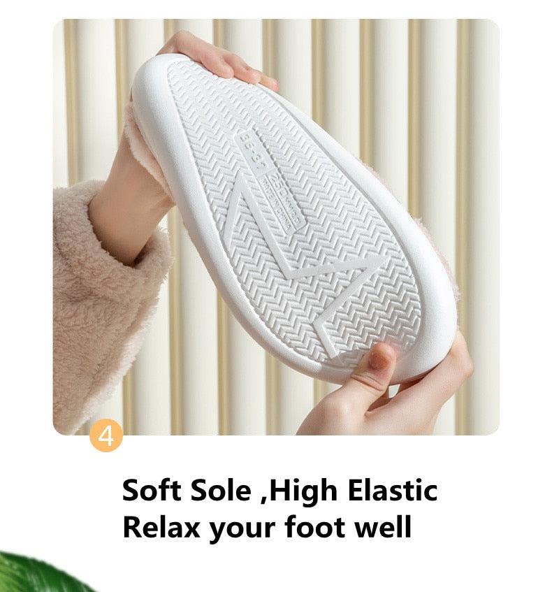 White textured outsole of plush deer slippers with thick sole profile