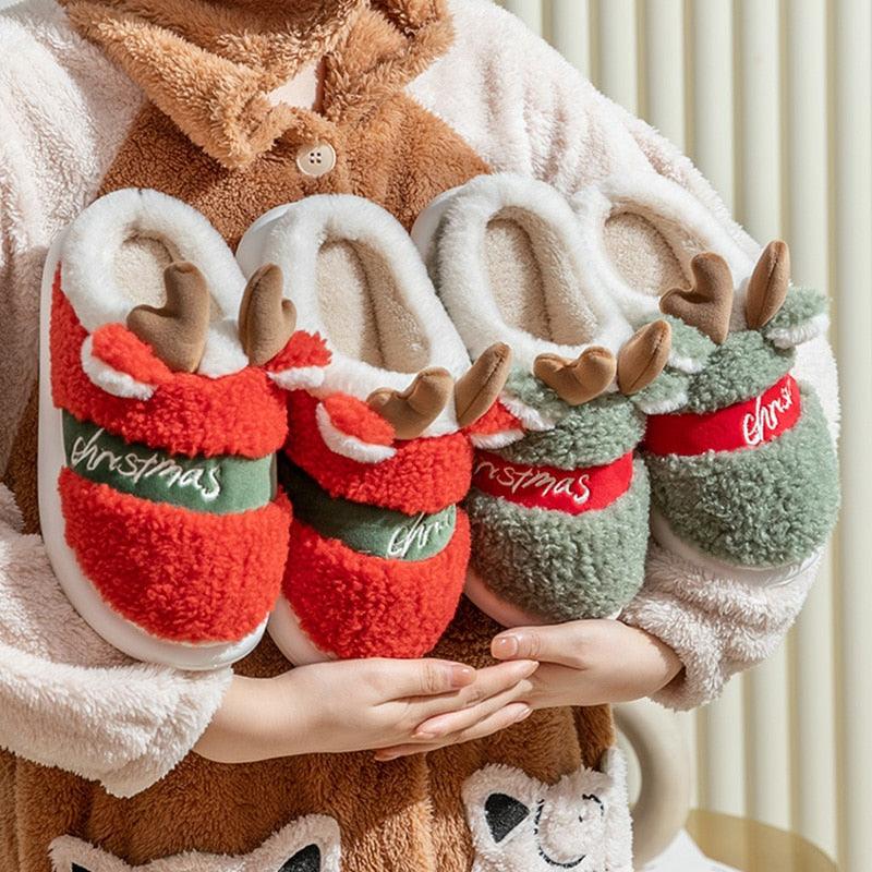 Plush Christmas deer slippers, red and green styles with 'Christmas' lettering