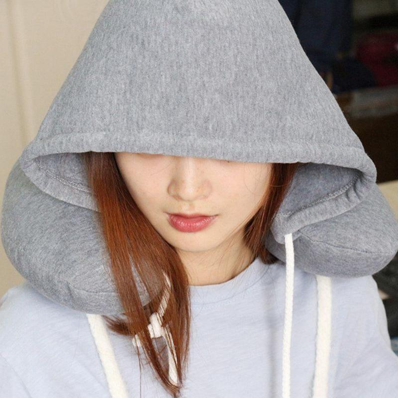 Hooded travel neck pillow, heather gray worn with hood and drawstrings