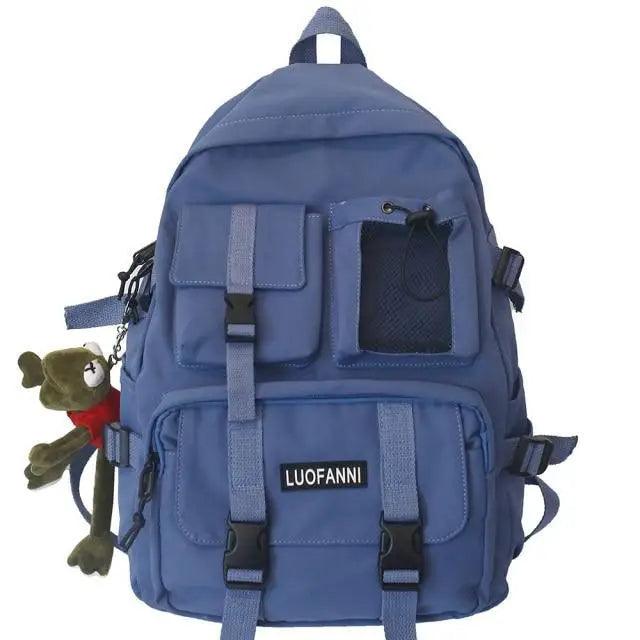 Blue nylon backpack with front flap pocket, mesh panel, and adjustable straps