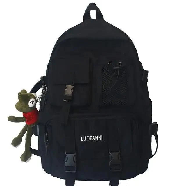 Black nylon backpack with front flap pockets, mesh panel, and adjustable straps