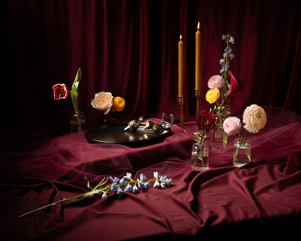 Decorative oval tray centerpiece with candles and assorted ornaments