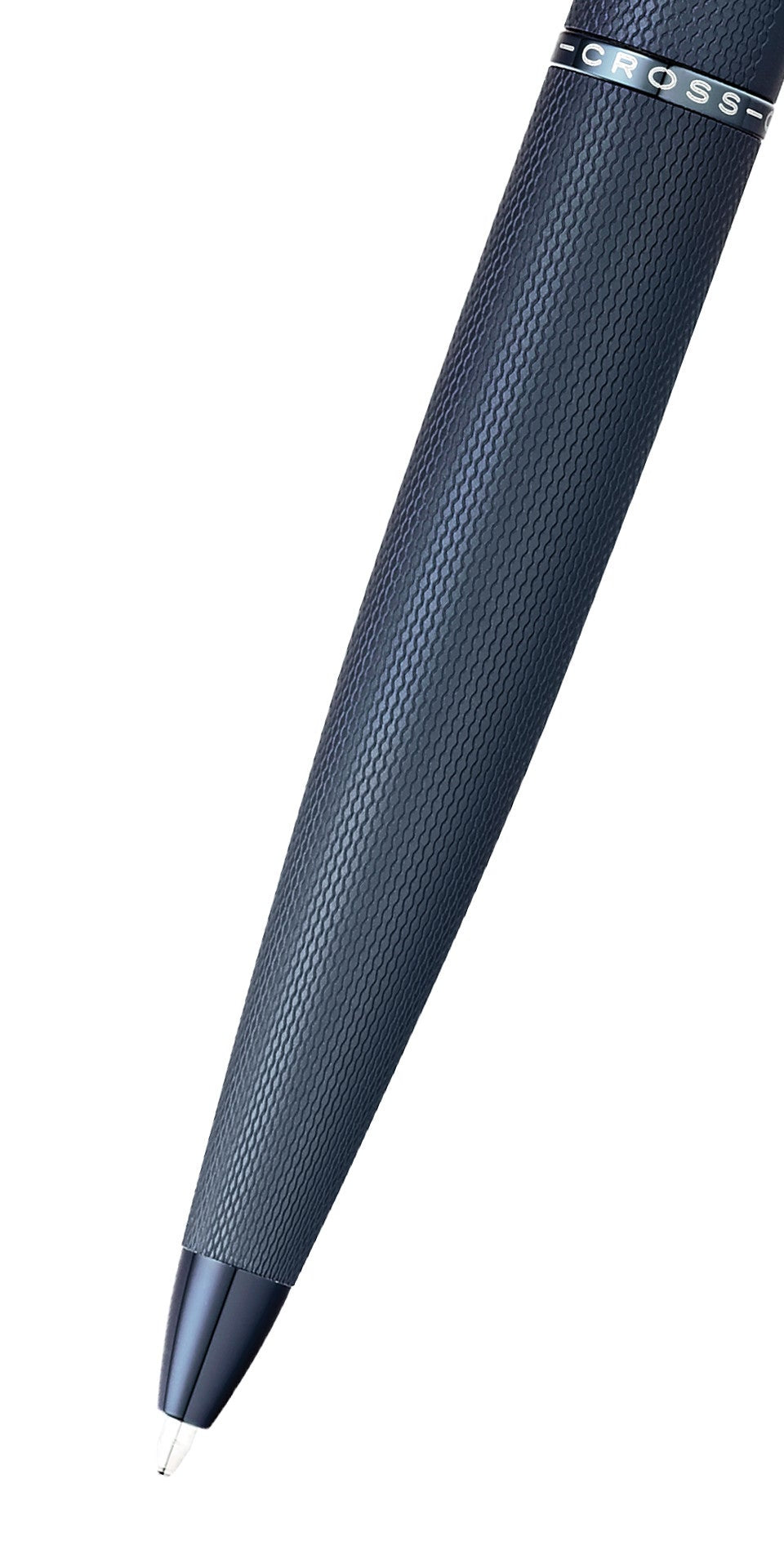 Dark blue ballpoint pen angled view, textured barrel and metal clip