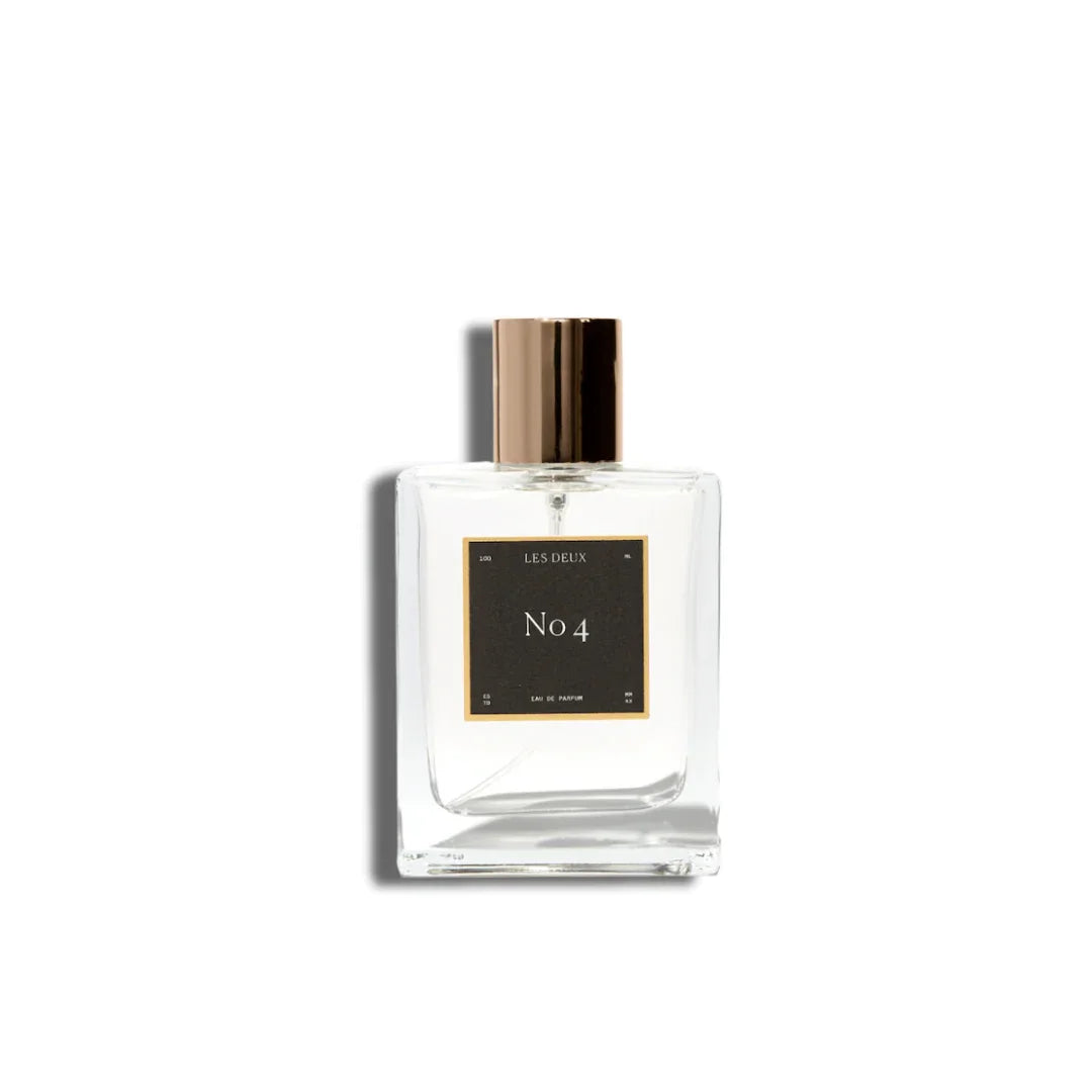 Glass perfume bottle with gold cap and front label showing No 4