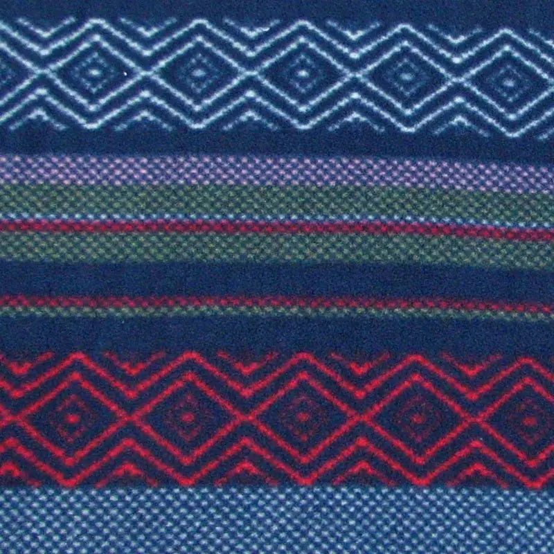 Fleece tabi sock fabric close-up with zigzag and stripe pattern in blue, red, green