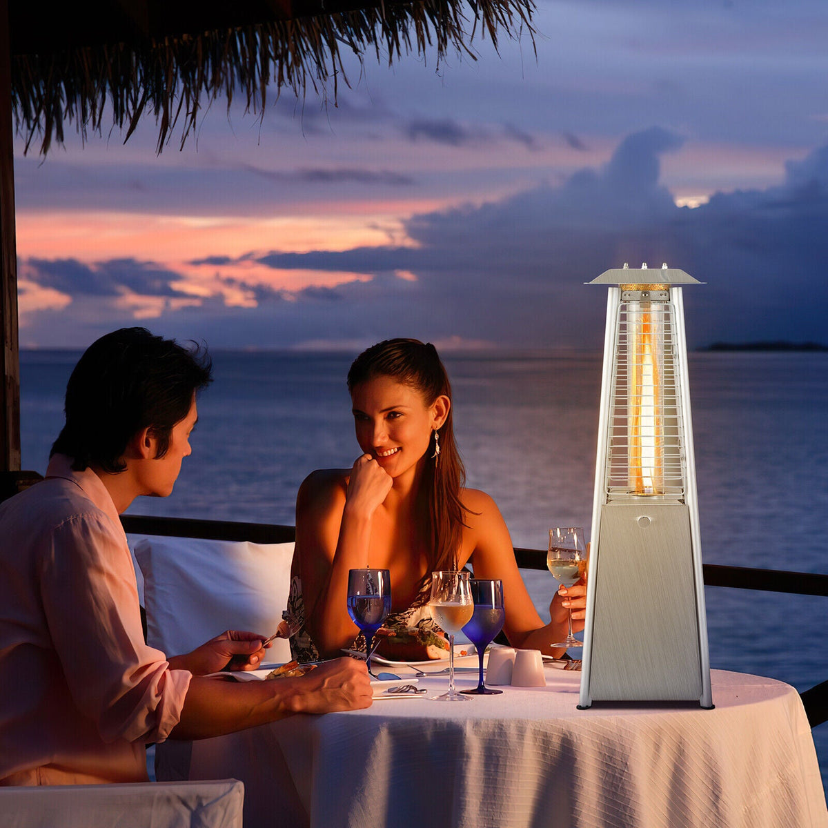 Portable tabletop patio heater with glowing glass tube and stainless steel housing