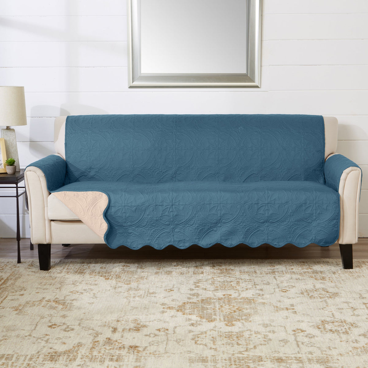 Blue medallion sofa protector cover on beige armchair