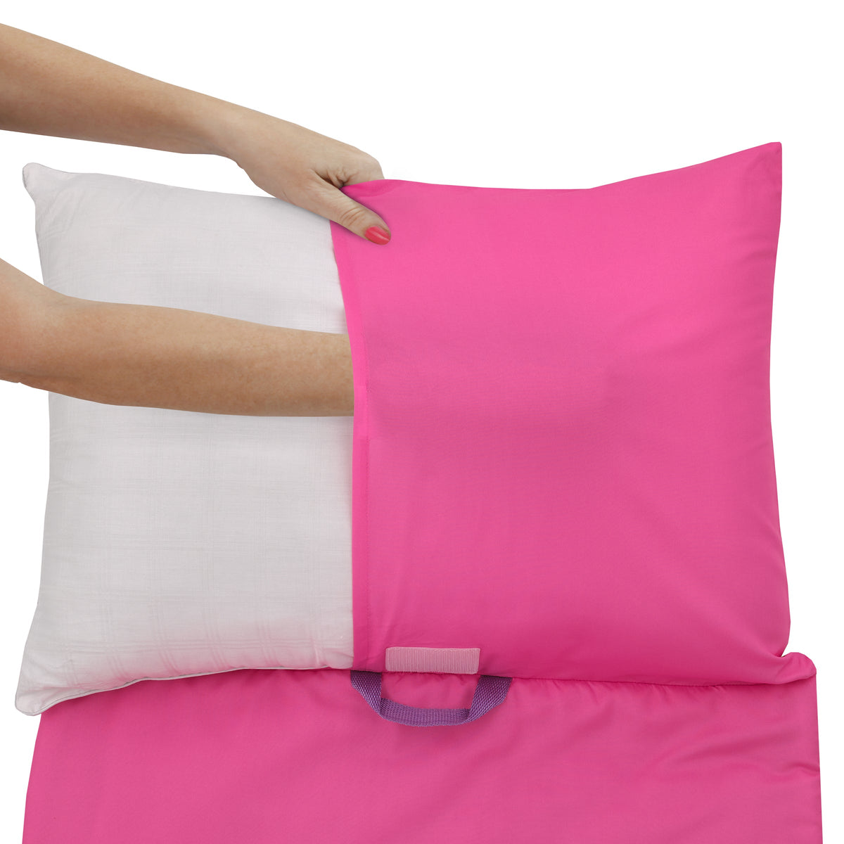 Pink nap mat cover being placed over a white pillow insert by a hand