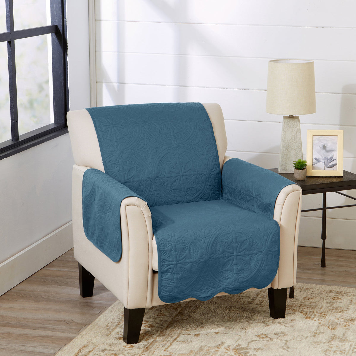 Blue medallion armchair protector with beige edges and quilted upholstery cover