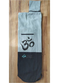 Gray and black cotton yoga mat bag with an Om symbol pocket and shoulder strap