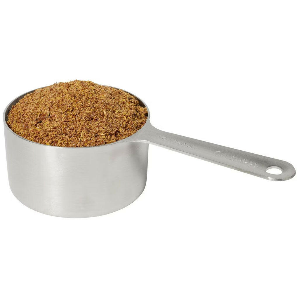 Metal scoop filled with brown horse skin and coat powder supplement