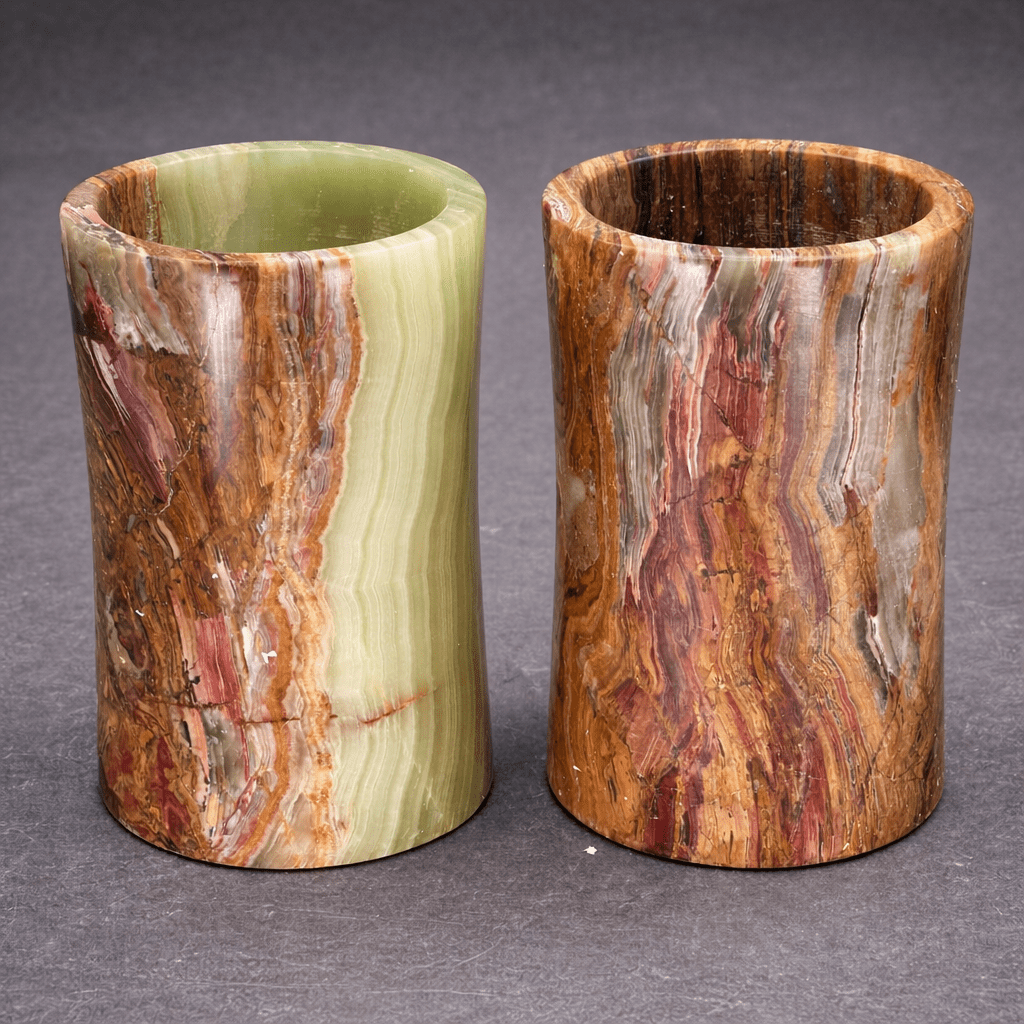 Pair of onyx cylinder vases, green and brown striped stone with open round mouths.