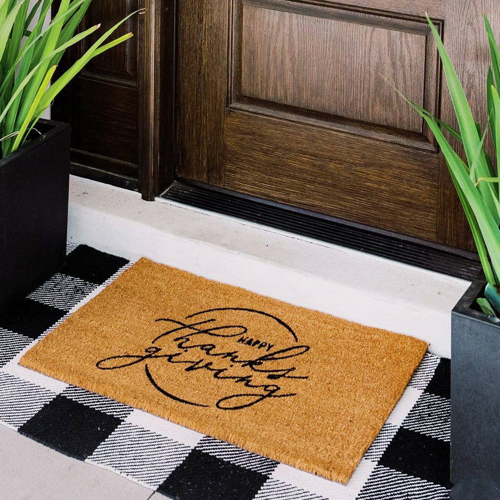 Natural coir doormat with "Happy Thanks giving" lettering for outdoor entryways