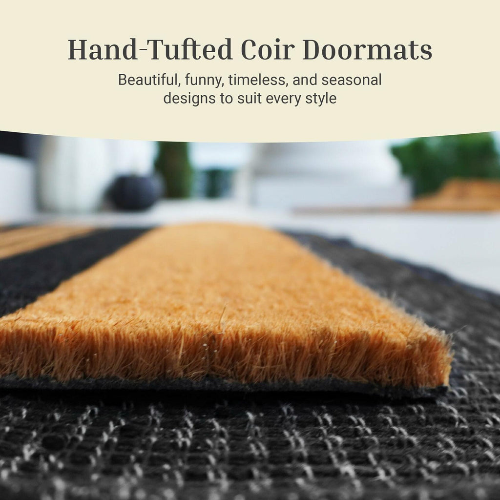 Hand-tufted brown coir doormat with thick fringe edge and textured surface
