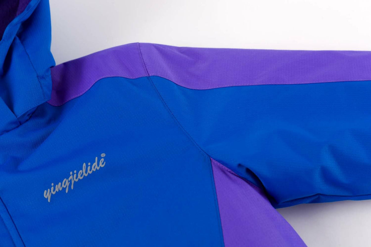 Close-up of chest panel and logo on blue and purple waterproof ski jacket.