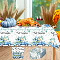 Blue fall pumpkin tablecloth with illustrated trucks, pumpkins, and matching napkins set