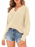 Ribbed knit V-neck long-sleeve sweater in light beige, relaxed fit.