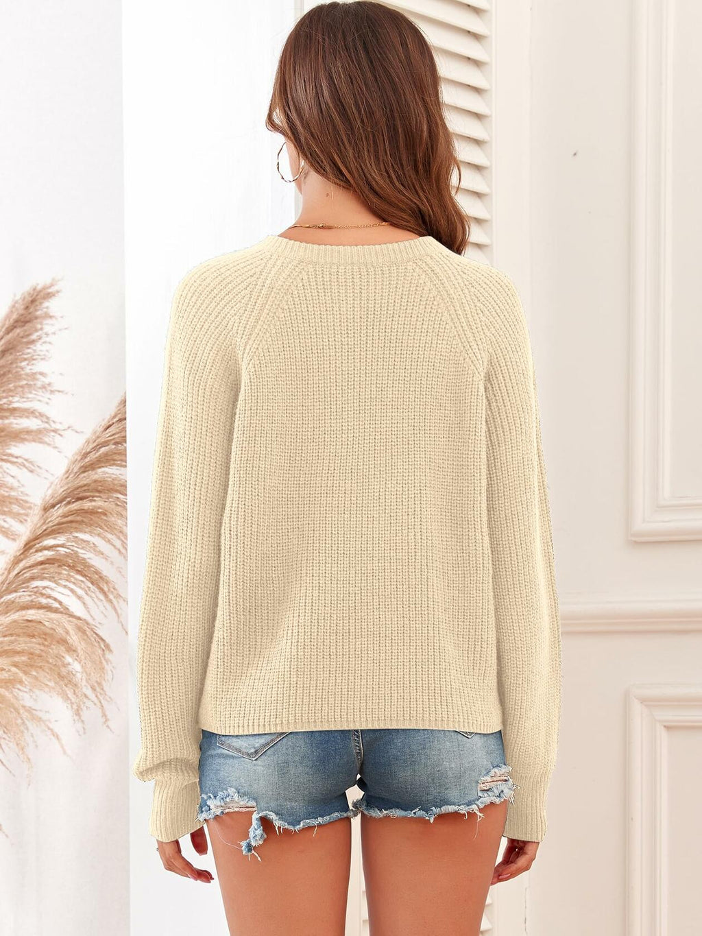 Ribbed knit V-neck long-sleeve sweater, light beige, rear view from back.