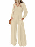 Light beige smocked waist long-sleeve V-neck jumpsuit with wide legs
