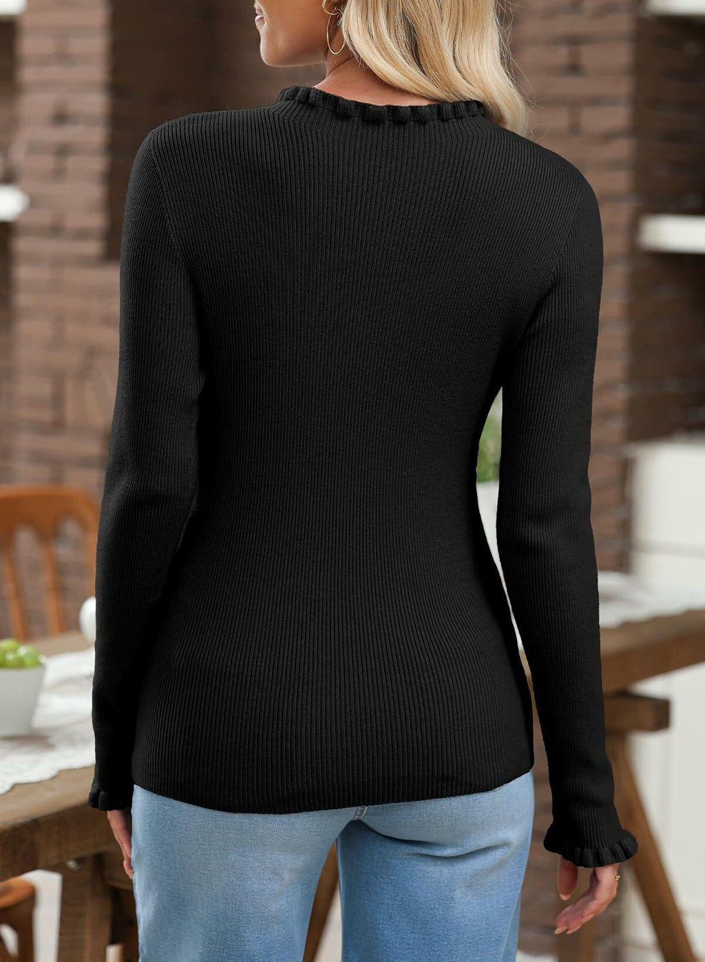 Women's black ribbed knit sweater with long sleeves, back view