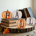 Set of 4 painted pumpkin wood letter signs: F, A, T, L in orange and white