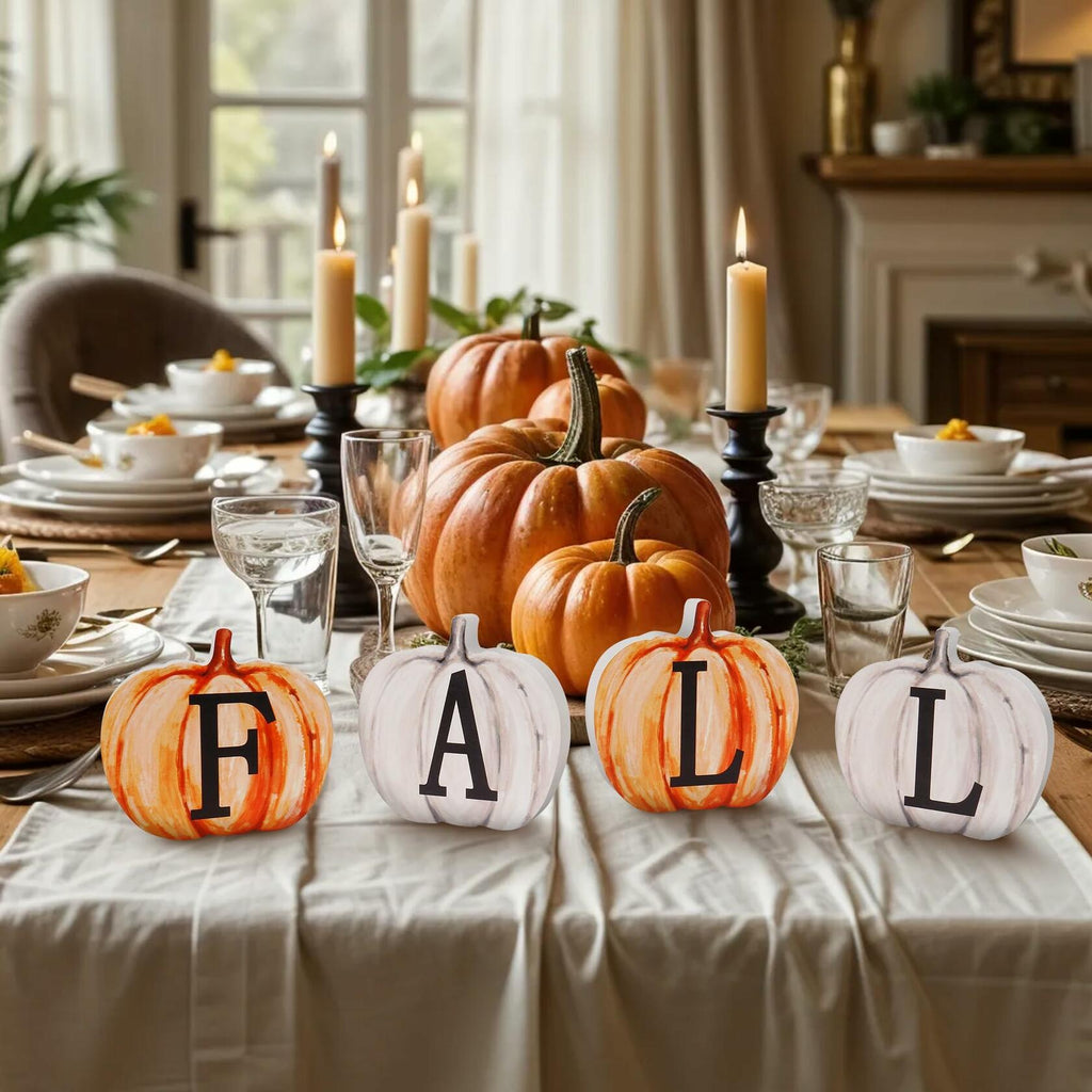 Table centerpiece with pumpkin wood letter signs: F, A, T, L and candles
